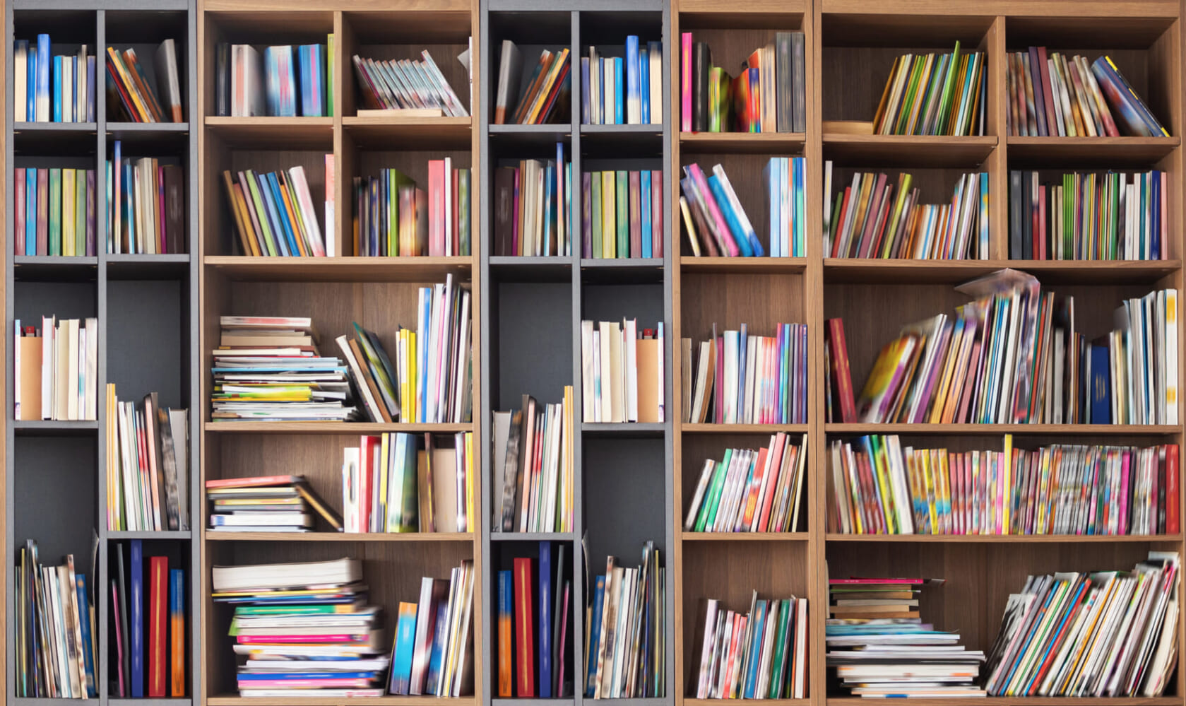 Wide book shelves with blurry effect on book cover